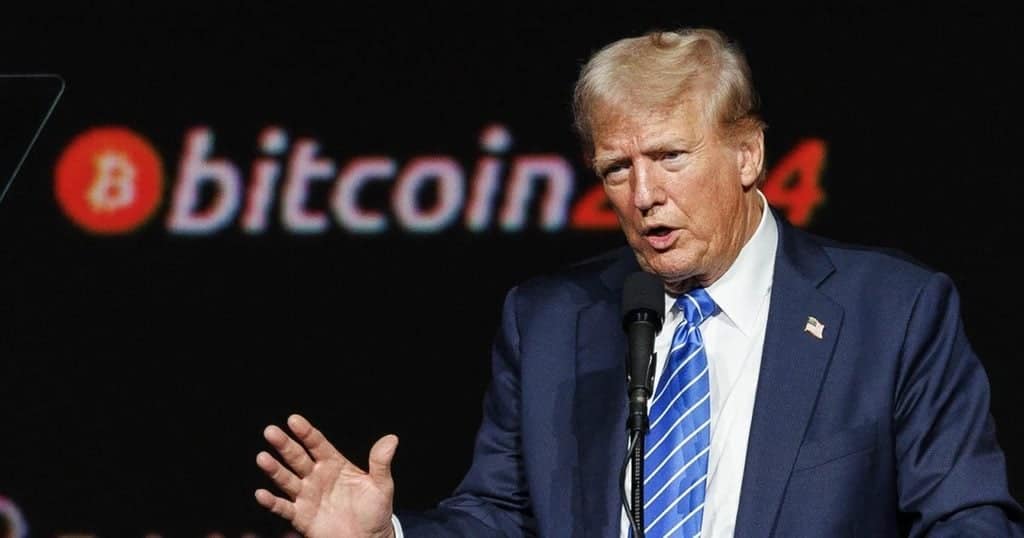 Donald Trump speaking at a Bitcoin conference with a Bitcoin logo in background.